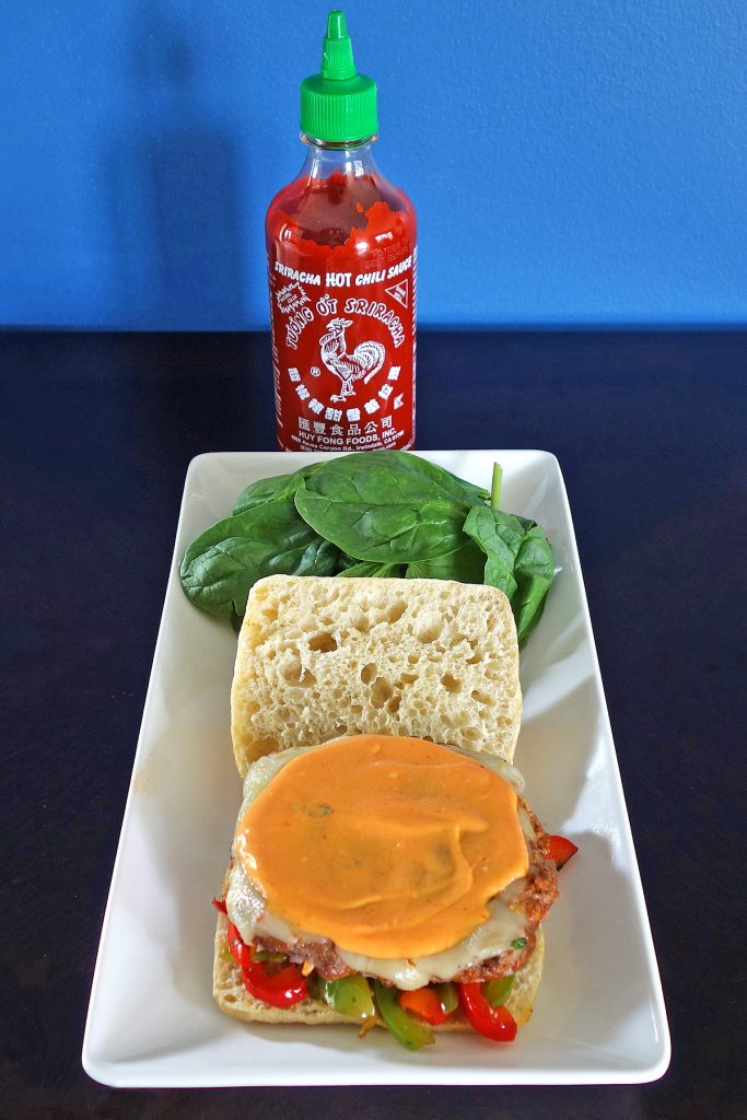 The Rooster Sriracha Burger has stir fried veggies, Sriracha marinated meat, and rooster mayo. This rooster will wake you right up!