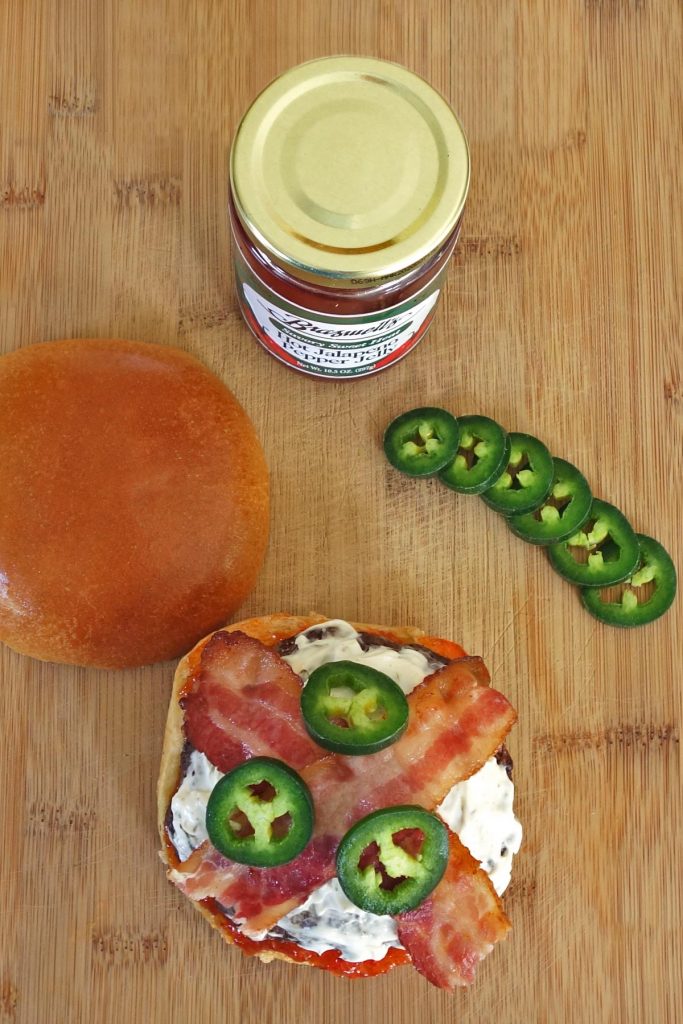 Jalapeno Burger with Cream Cheese, Bacon, and Jalapeno Jelly. This burger melts in your mouth with a kick of spice!