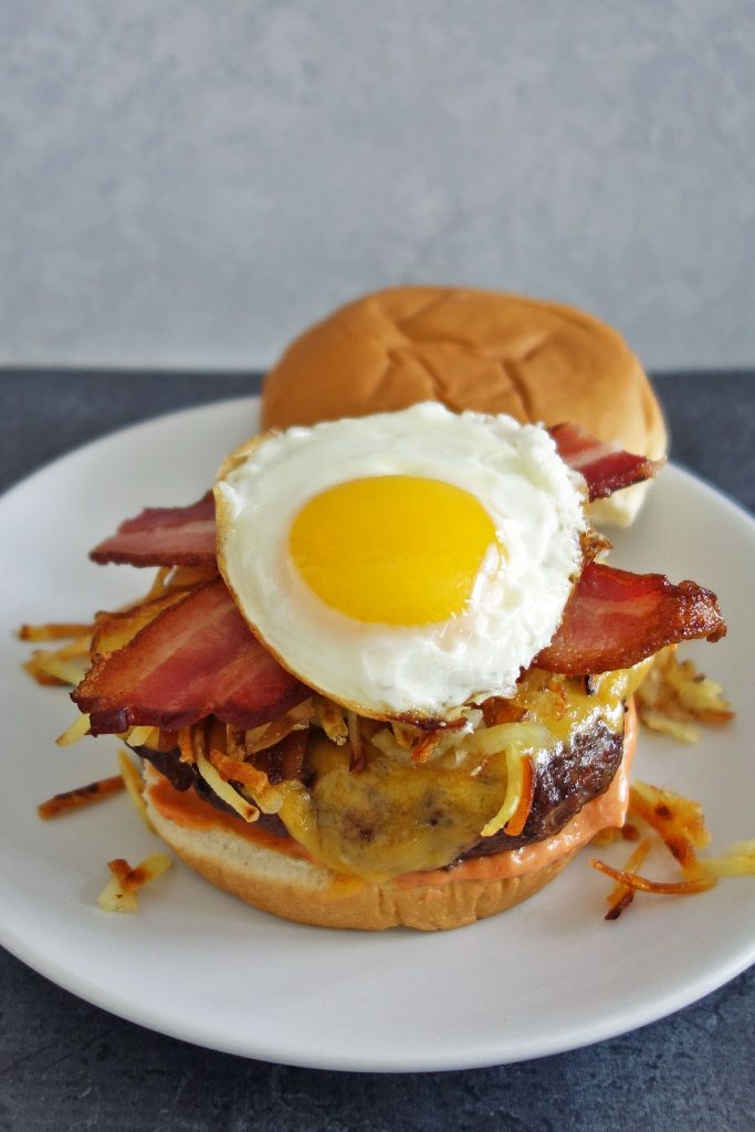 Hangover burger topped with hash browns egg and bacon