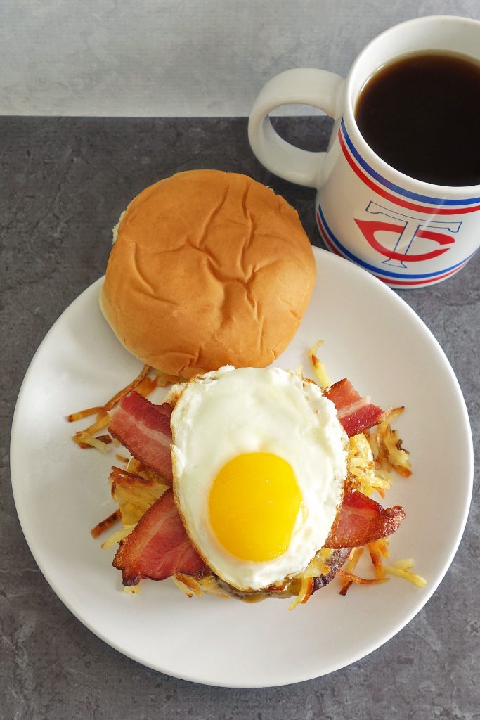hangover burger topped off with hash browns and a sunny side up egg