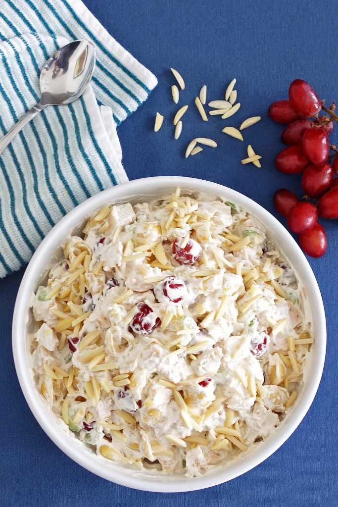 This chicken salad with grapes makes an awesome side dish or main meal. It's really simple to make with cubed chicken, pasta, grapes, celery and a whip & mayo topping. Great for sharing or potlucks!