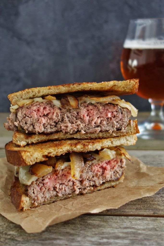The patty melt is a traditional cheeseburger with caramelized onions on sliced rye bread that's been enjoyed since the 40's. Enjoy this burger recipe!