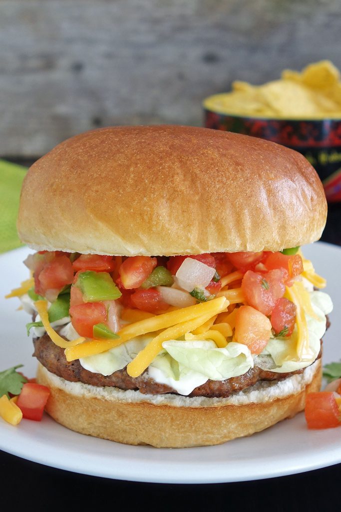 The taco burger is a delicious burger seasoned and topped like your favorite tacos.