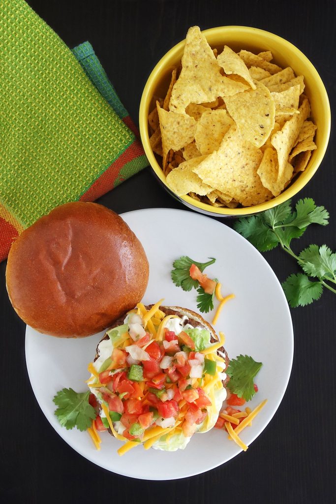 The taco burger is a delicious burger seasoned and topped like your favorite tacos.